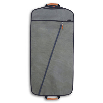 Grey garment bag with a diagonal zipper and two leather-wrapped handles on top and bottom.