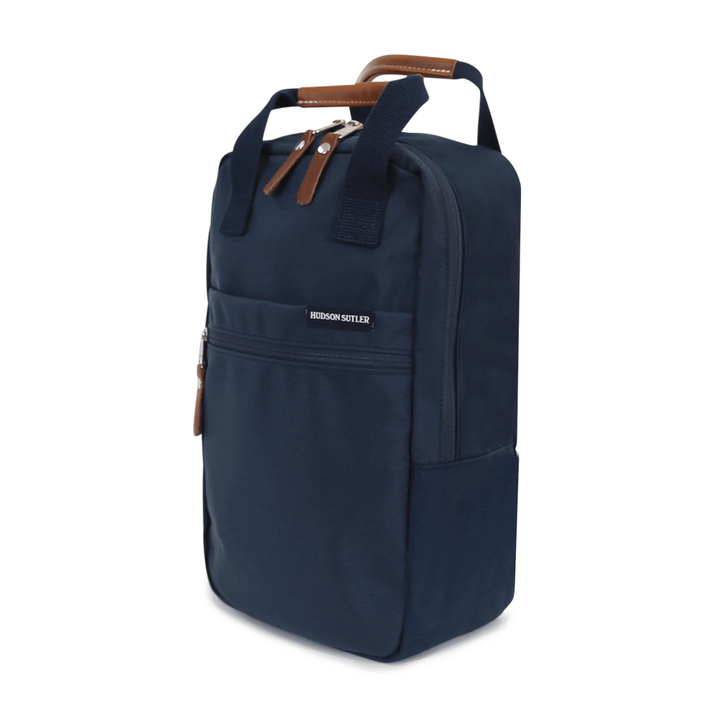 A navy blue nylon shoe bag with partially leather-wrapped handles and a front zipper.